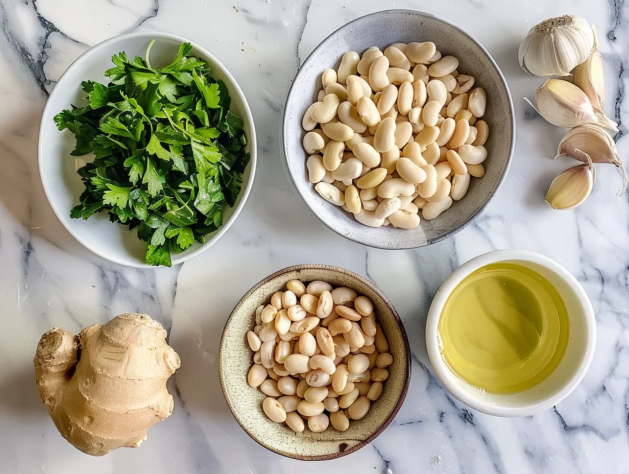 Raw ingredients for homemade white bean soup, including cannellini beans, carrots, celery, and herbs.